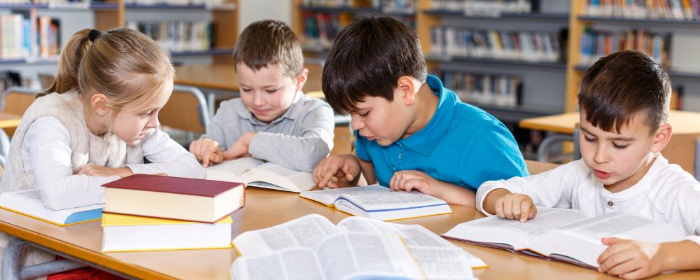 Kids reading in school library